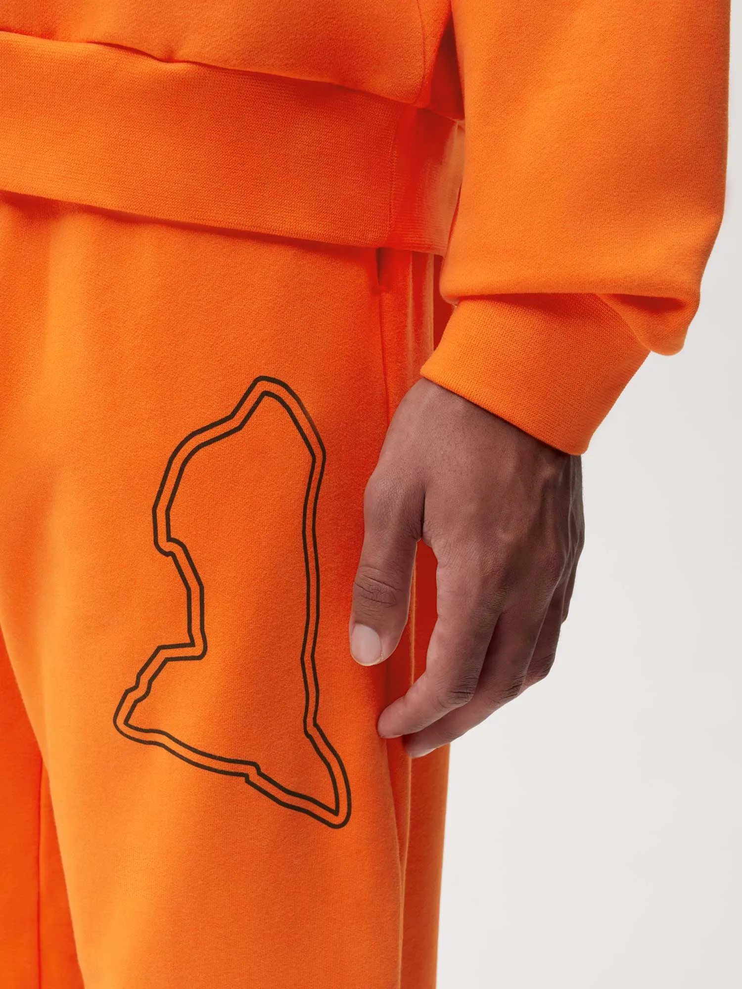 PANGAIA x Extreme-E Track Pants—persimmon orange