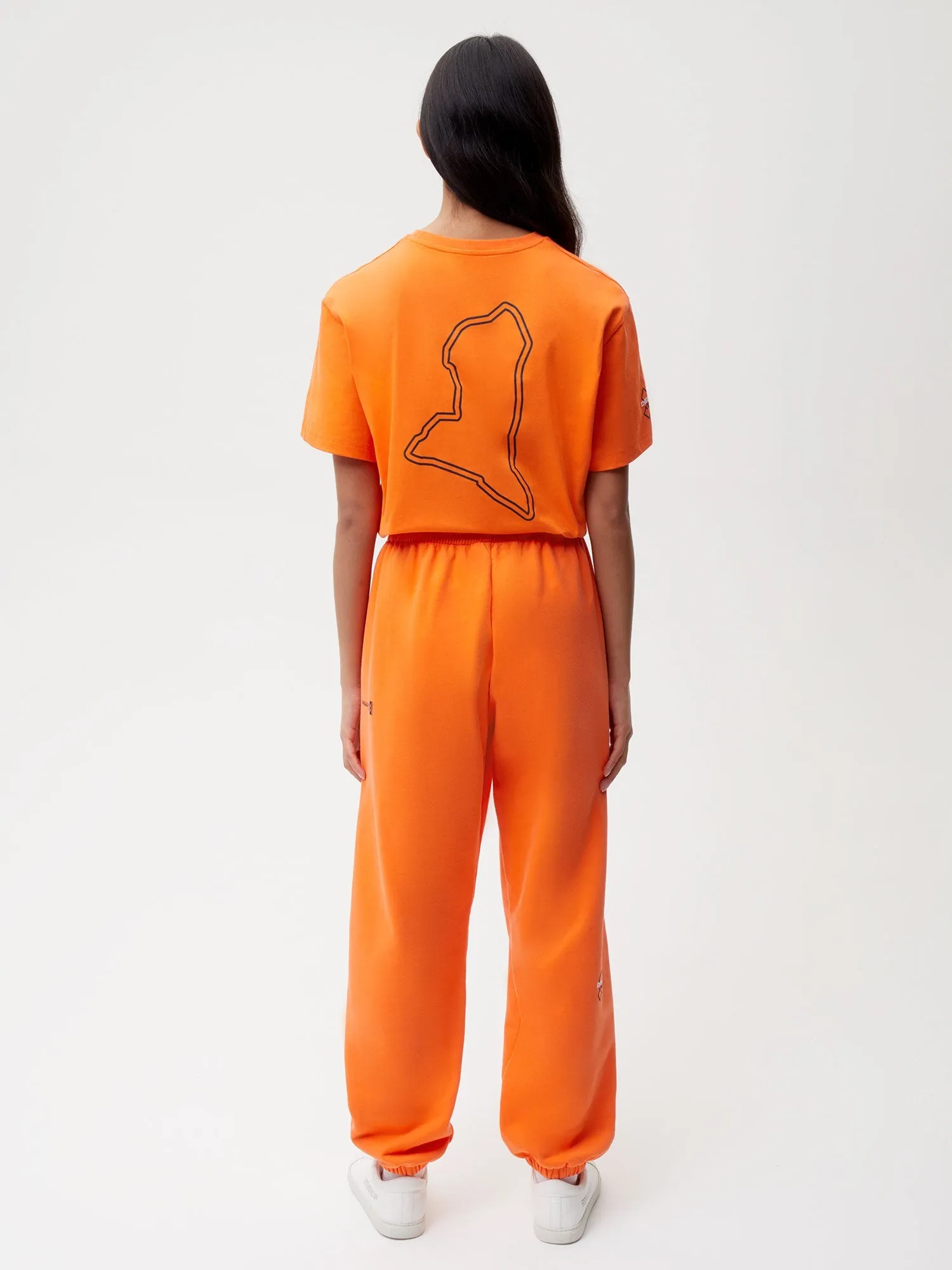 PANGAIA x Extreme-E Track Pants—persimmon orange